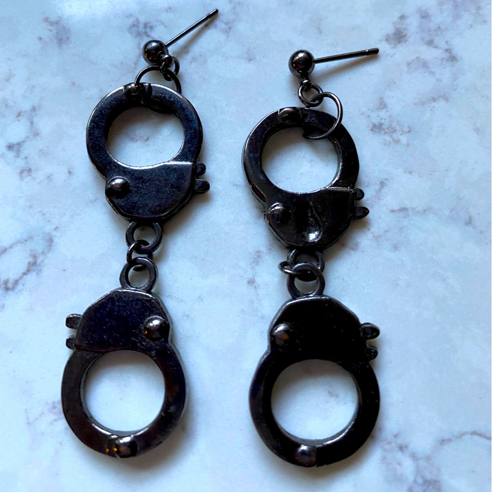 Cute handcuff earrings. Good condition.
